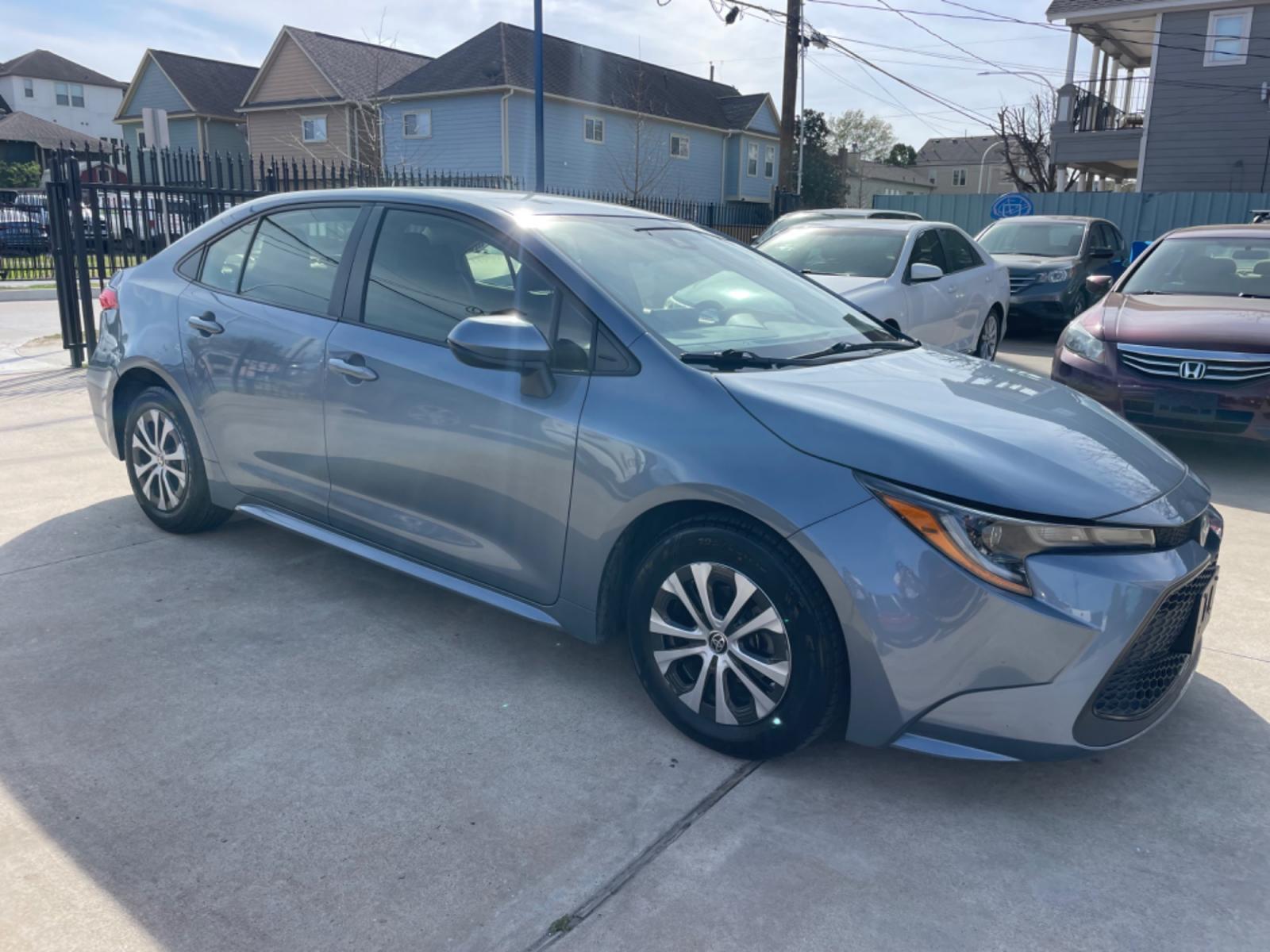 2022 Blue /Silver Toyota Corolla LE (JTDEAMDEXNJ) with an 1.8L Hybrid engine, Automatic transmission, located at 1501 West 15th St., Houston, 77008, (713) 869-2925, 29.797941, -95.411789 - Photo #1